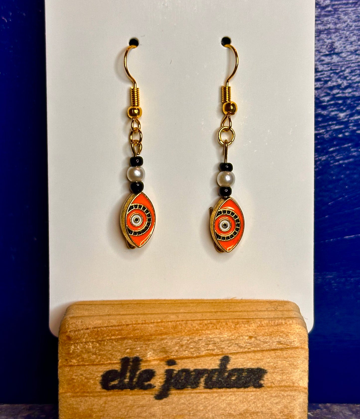 Gold Dangle with Orange and Black Detail Charm