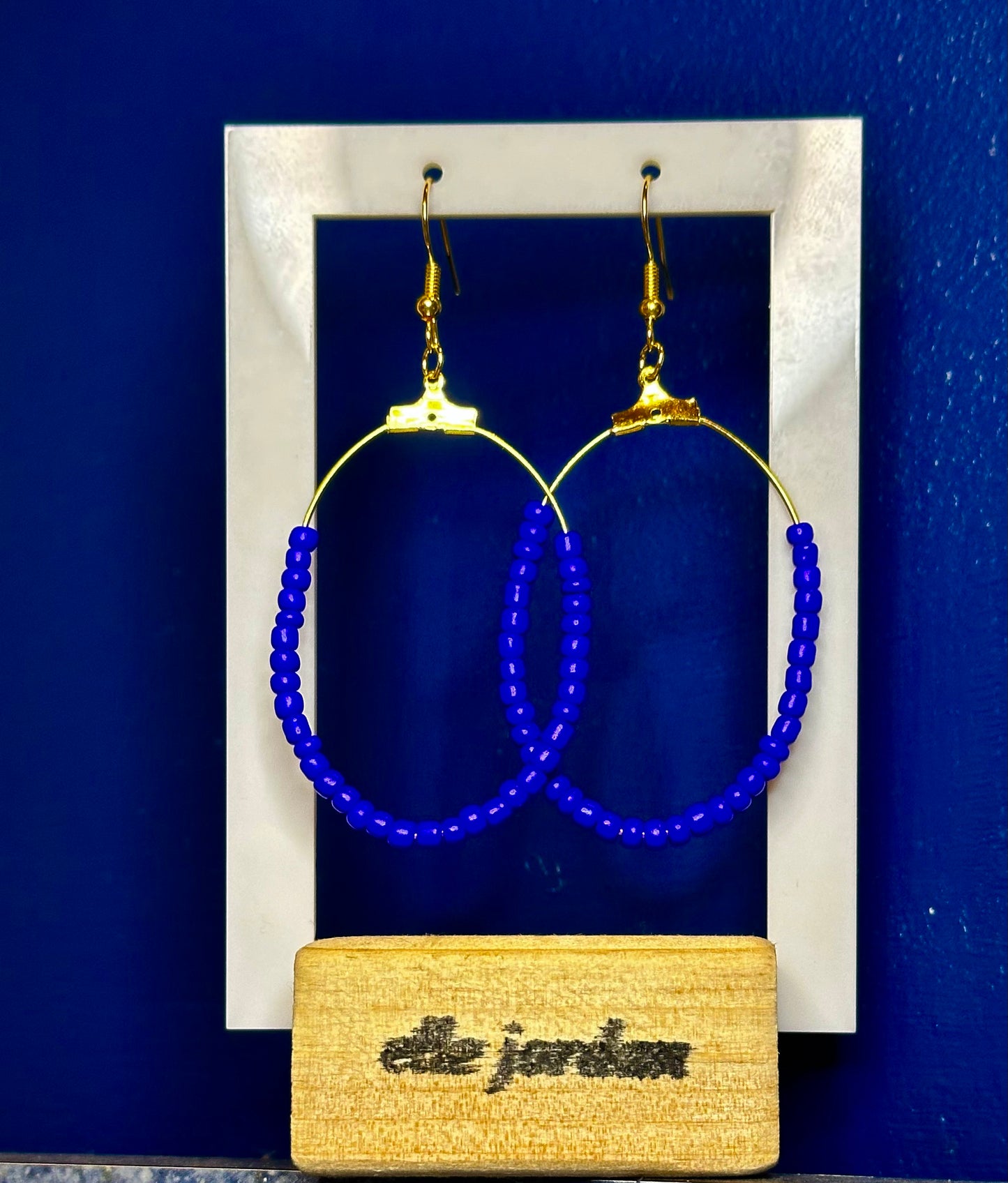Large Gold Oval Dangle with Deep Purple Beads