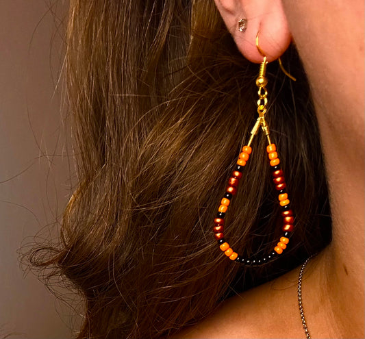 Gold Teardrop Dangle with Variety Orange and Black Beads
